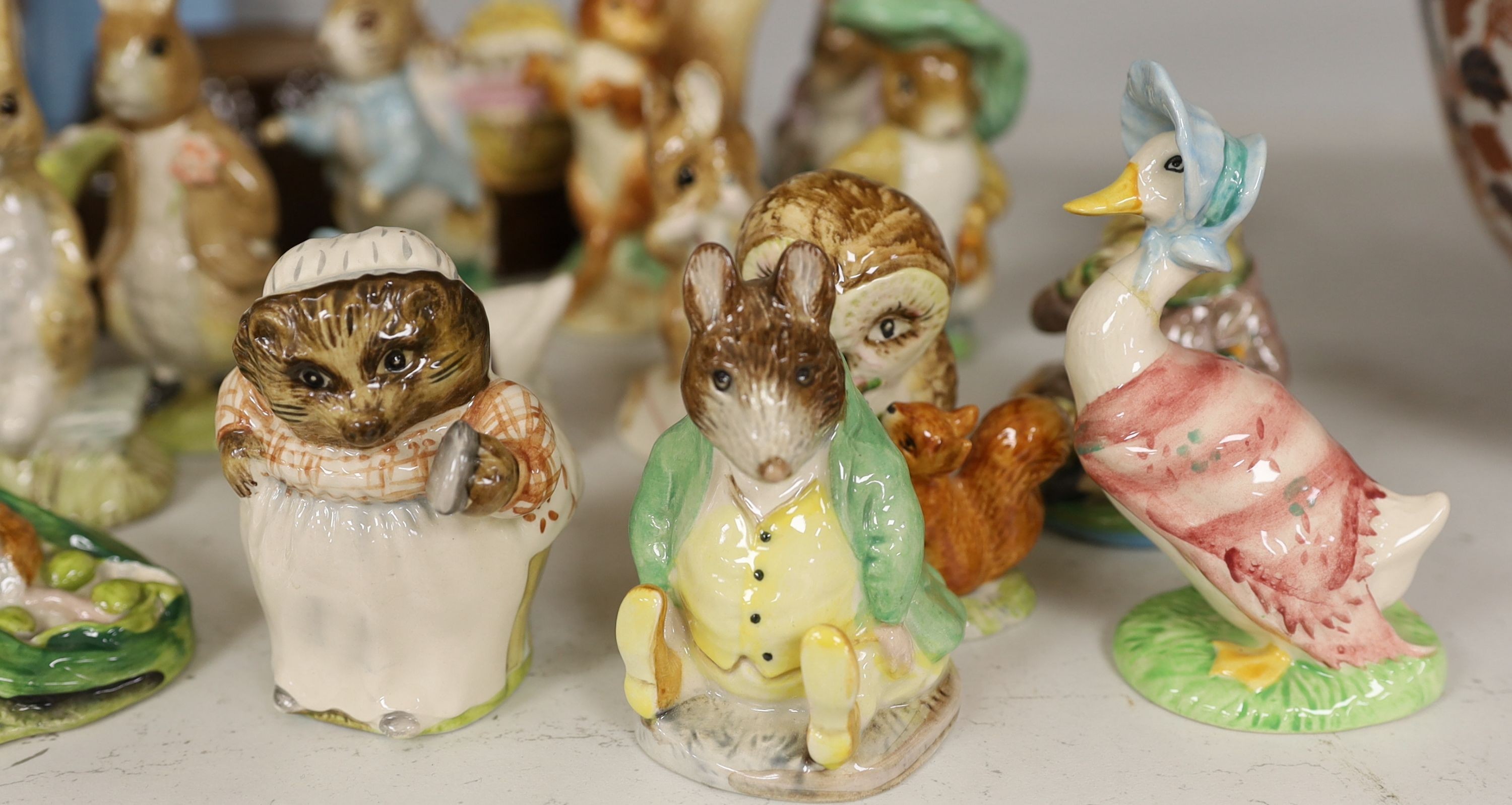 A collection Beswick, Royal Albert and Border Fine Arts Beatrix Potter figures